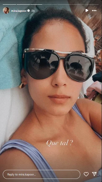 Mira Kapoor laying down on the beech